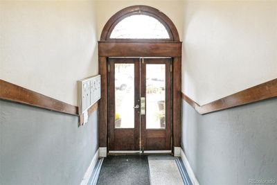 Original original double doors with transom upon entry into the house | Image 2