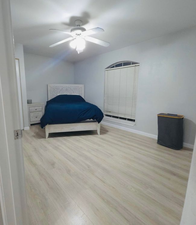 Bedroom 3 with wood finished floors and ceiling fan | Image 23