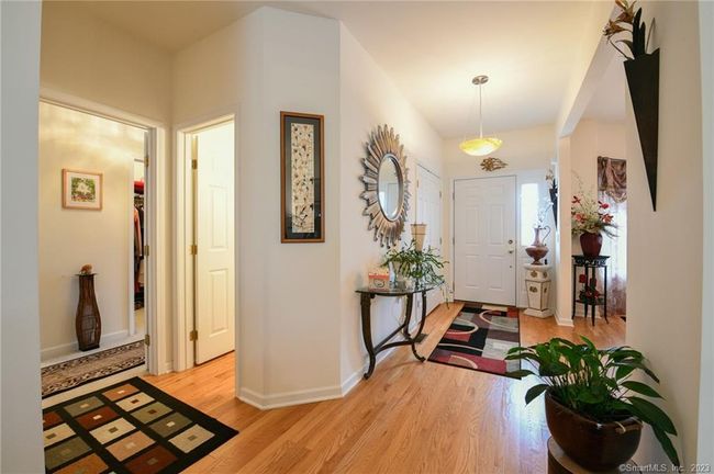 Elegant half bath for guests is just outside the entrance to the first floor primary suite. | Image 6