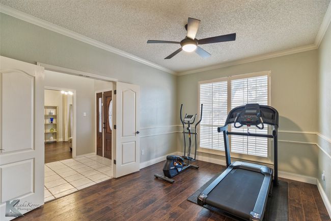 This can be a formal dining area, office, playroom or workout room. | Image 12