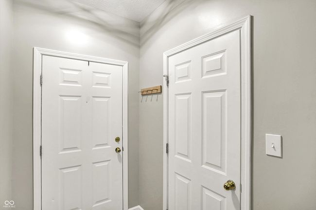 foyer with front and garage doorway | Image 5