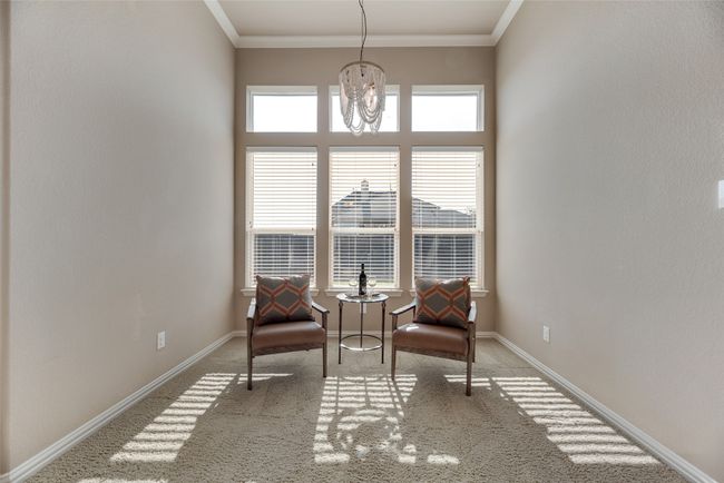 Sitting room with carpet flooring and crown molding | Image 15