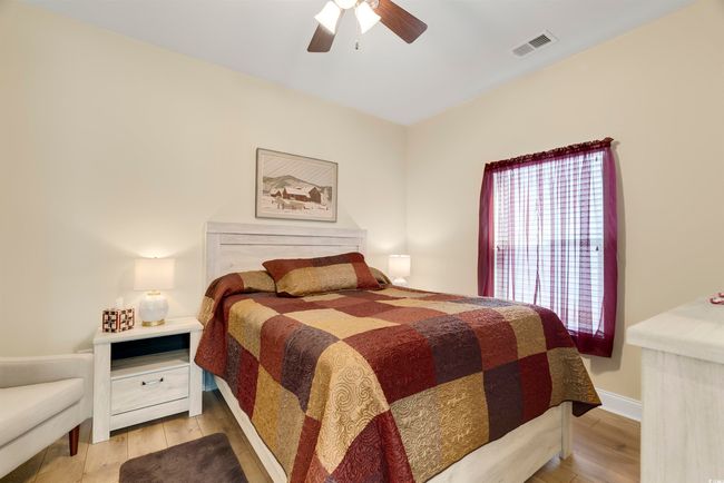 Bedroom with ceiling fan and light hardwood / wood-style floors | Image 25