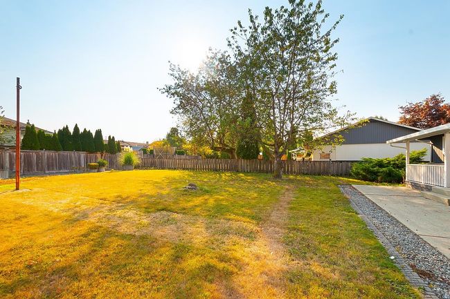View of fenced backyard | Image 31