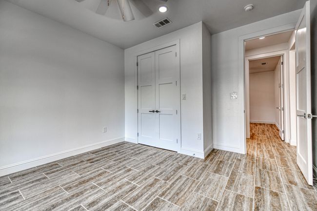 Unfurnished bedroom featuring a closet and ceiling fan | Image 18