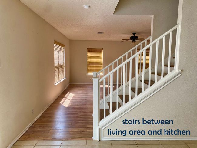 Stairway with vinyl floors, ceiling fan | Image 10