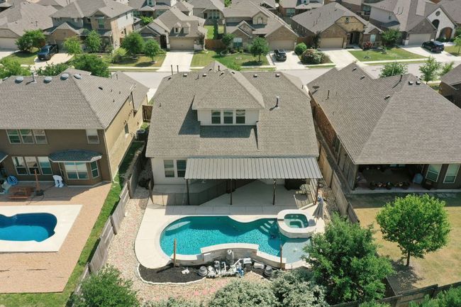 View of pool with a patio area and a residential view | Image 25