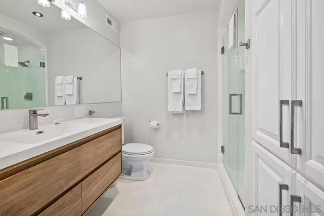 Main bath remodeled showing custom built in cabinets. | Image 22