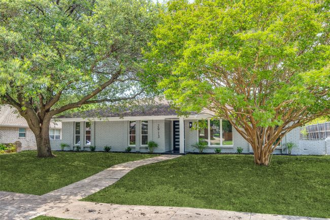 View of front facade featuring brick siding and a front lawn | Image 4