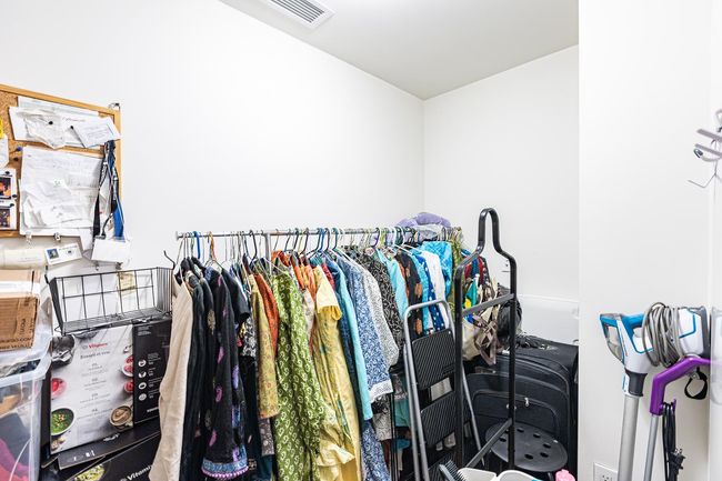 View of walk in closet | Image 12