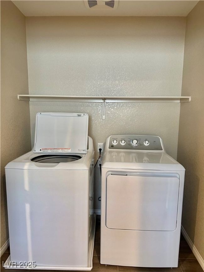 Laundry room with laundry area, visible vents, washer and clothes dryer, and baseboards | Image 23