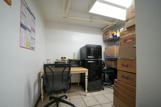 Office area with light tile patterned flooring | Image 11