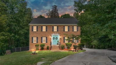 Colonial inspired home featuring a lawn | Image 1