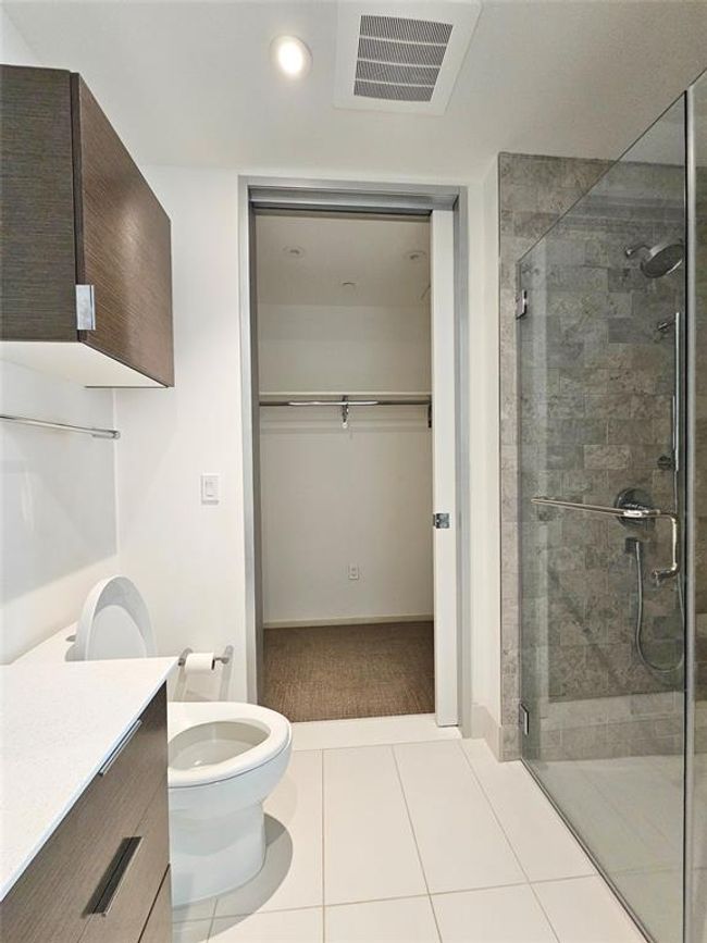 Full bathroom with visible vents, a shower stall, vanity, toilet, and recessed lighting | Image 9