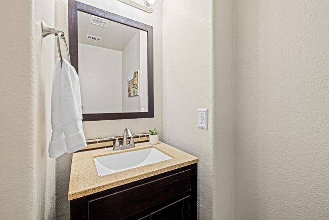 This main-level powder room is a convenient feature for both guests and daily living. | Image 31