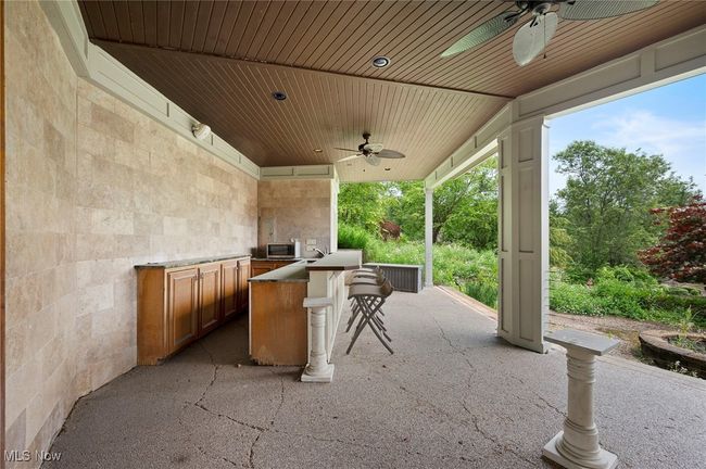 View of patio / terrace with ceiling fan and exterior kitchen | Image 49