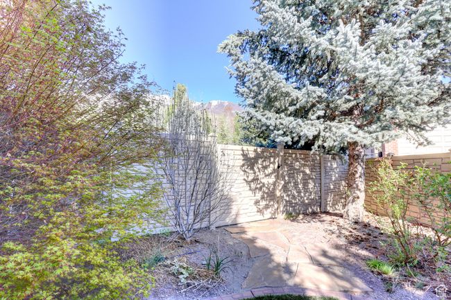 Exterior space with a mountain view and fence | Image 51