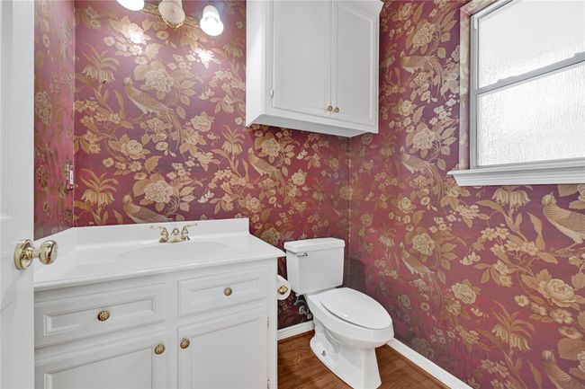 Convenient half bathroom adjacent to the family room. | Image 24