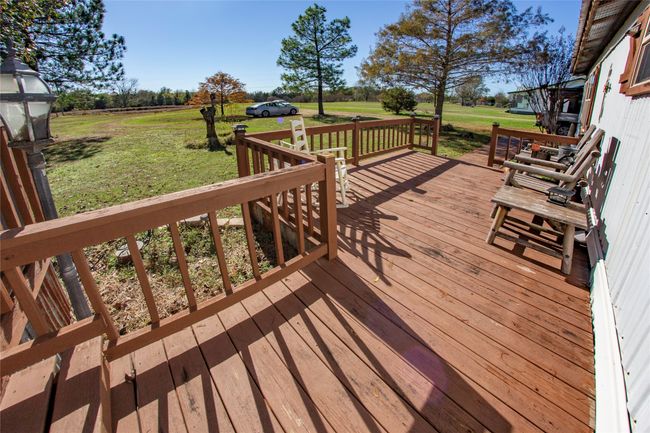 Wooden deck featuring a yard | Image 22