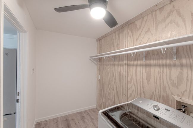 The enclosed laundry room is located downstairs. Washer and dryer convey. | Image 32