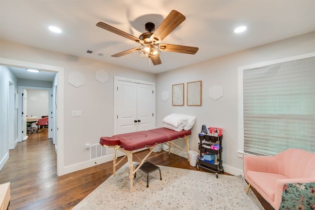 Office with ceiling fan, recessed lighting, wood finished floors, visible vents, and baseboards | Image 19