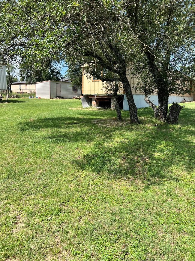 View of green lawn featuring an outbuilding | Image 22
