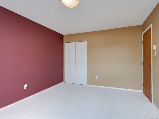 Unfurnished bedroom with carpet floors and a closet | Image 13