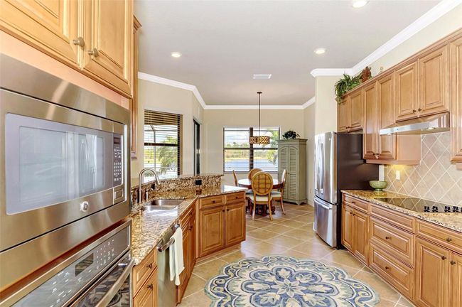Honey-Glazed Maple Cabinetry, Stainless and Granite Counters | Image 26