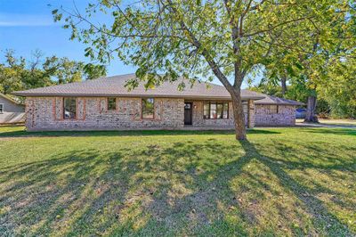 Ranch-style house featuring a front lawn | Image 1