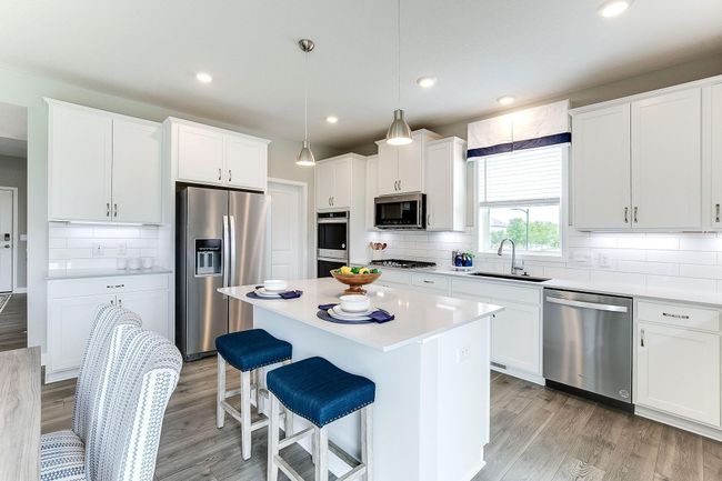 Kitchen & dinette with more seating at the breakfast bar, it's good to have options. | Image 5
