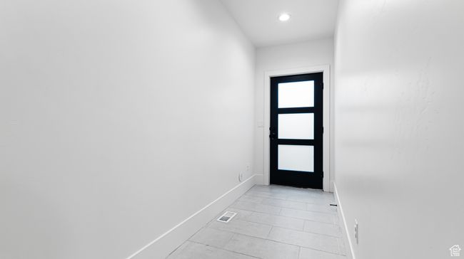 Doorway with baseboards, visible vents, recessed lighting, and light tile patterned floors | Image 59