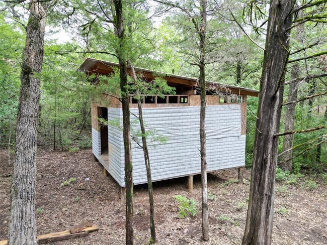 View of outdoor structure featuring a view of trees | Image 10