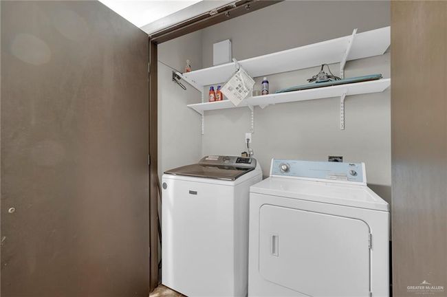 Laundry area featuring independent washer and dryer | Image 9