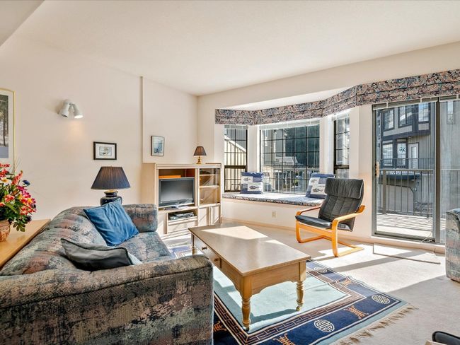 Living area with carpet flooring | Image 7