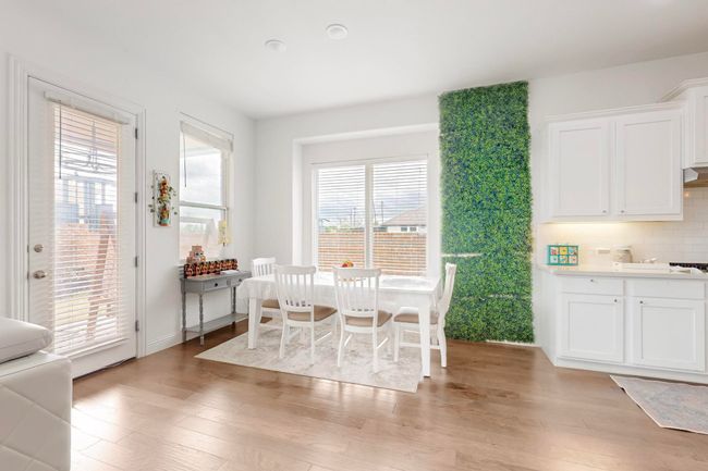 Dining area with light wood finished floors | Image 8
