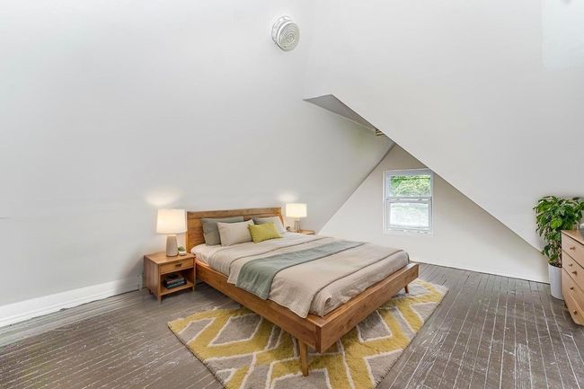 Bedroom with wood-type flooring and vaulted ceiling | Image 21