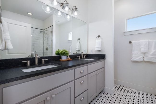 Primary ensuite features gorgeous tile floors, dual vanity, recessed lighting and walk-in shower. | Image 32