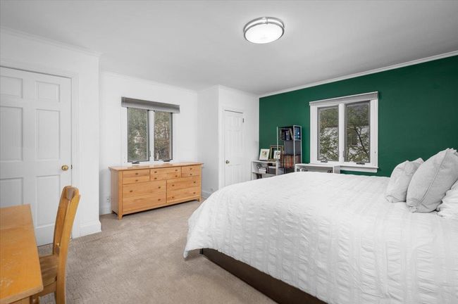 Bedroom featuring baseboards, carpet floors, ornamental molding, and multiple windows | Image 14
