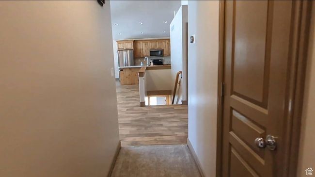 Hall featuring an upstairs landing, a sink, baseboards, and recessed lighting | Image 22