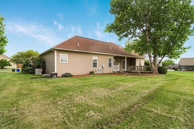 Back of property with a yard and a wooden deck | Image 4
