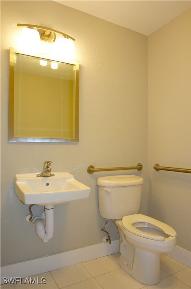 Half bath featuring toilet and tile patterned flooring | Image 13
