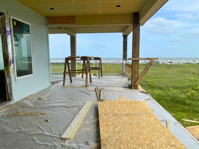 A blank slate with unbeatable views — this expansive covered patio is prepped to become a screened-in retreat, perfect for catching sunrise with coffee or evening breezes without the bugs. | Image 33
