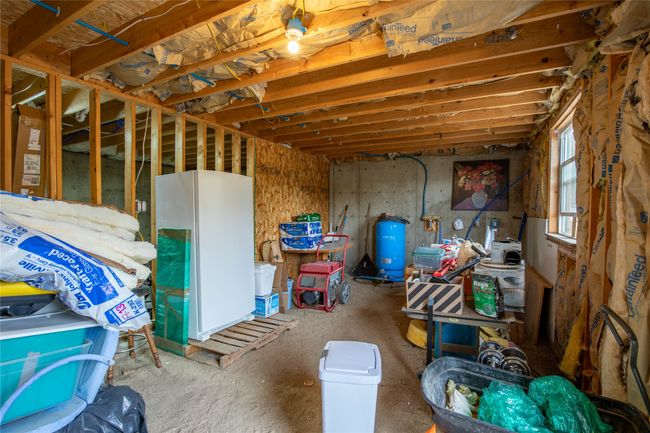 Below grade area featuring a water pressure tank | Image 22