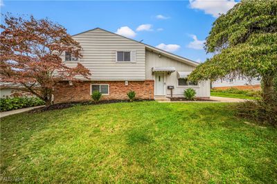 View of front of home featuring a front yard | Image 1