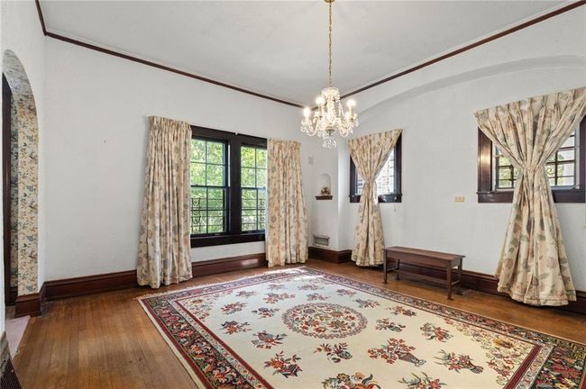 Large Dining Room with beautiful window casings and chandelier. | Image 8
