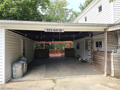 View of parking featuring a carport | Image 3