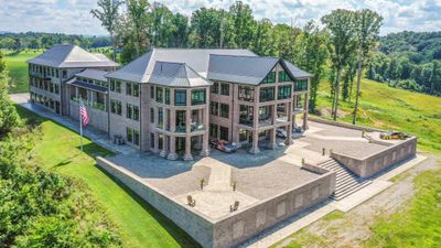 This home was designed to take full advantage of it's lake view from it's perch high above Dale Hollow Lake. To accomplish this, there are multiple patios, porches and sun rooms - each with their own amazing vantage points of the water. | Image 3