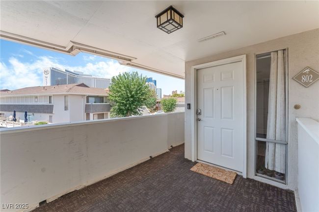 Doorway to property with a balcony | Image 12