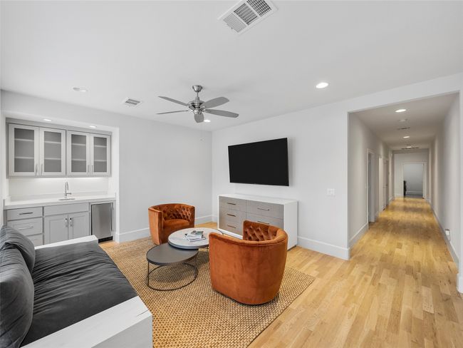 1st floor family room with light wood-style floors, recessed lighting, and ceiling fan | Image 32