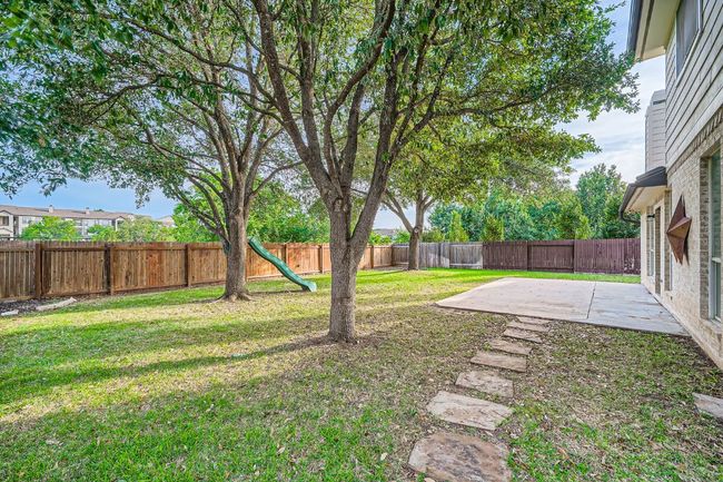 Large patio with mature shade trees | Image 35